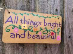 A sign saying "all things bright and beautiful"